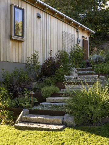 granite and corten steel steps with lush planting